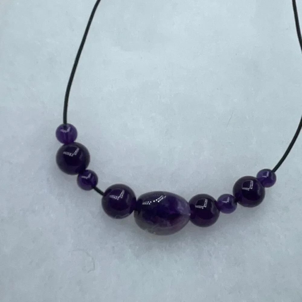 Amethyst cord beadedโnecklace 12โ drop.
